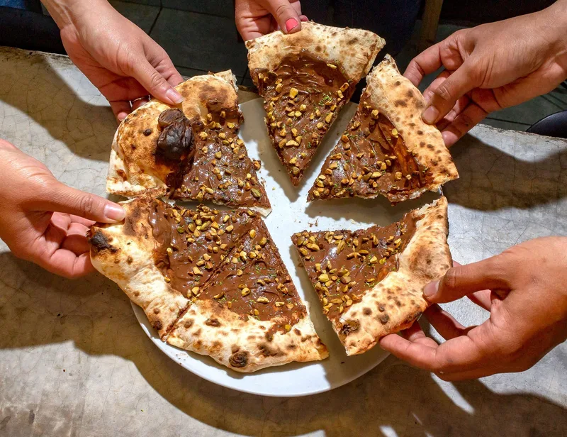 Otto: pizza gratis e vicinato
